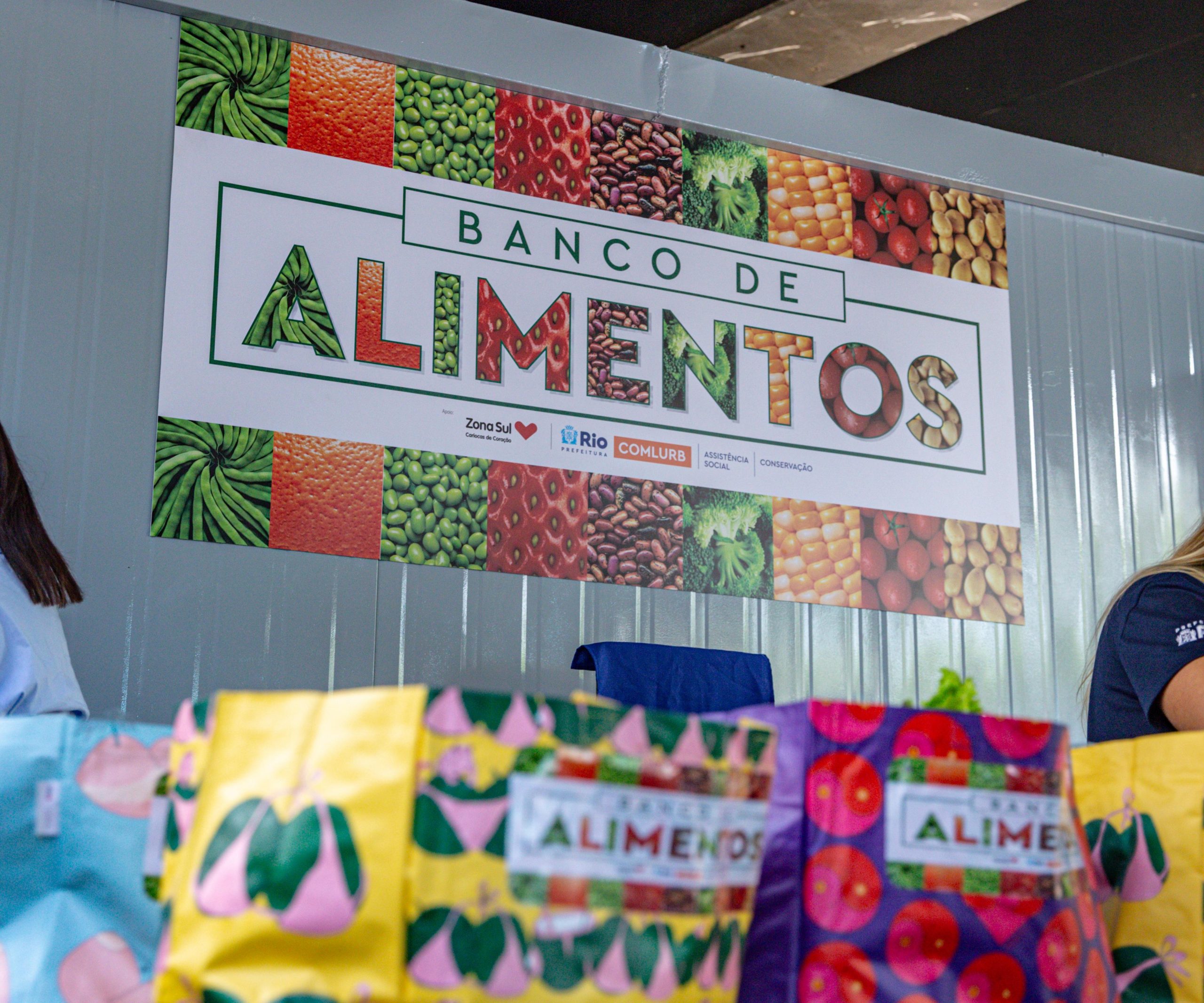 Imagem do logotipo do Banco de Alimentos da Comlurb na Cidade de Deus